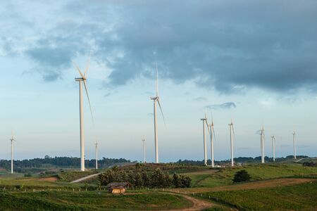 Windmill on the mountain landscape with blue skyの写真素材