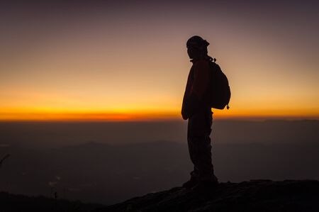 Silhouette light person looking sunset landscape