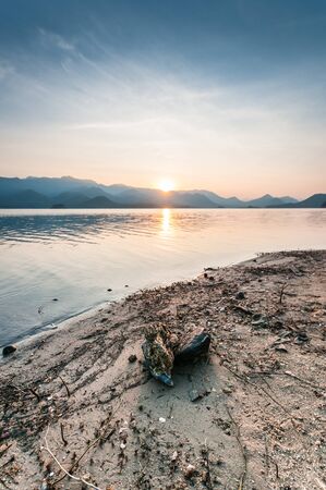 Mountain and lake with sunrise landscapeの写真素材