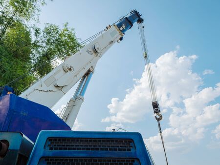 Closeup of Hydraulic Crane with blue skyの写真素材