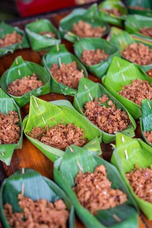 Asian snack food in banana leaf krathongの写真素材