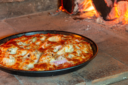 Closeup of pizza in the wood fire ovenの写真素材