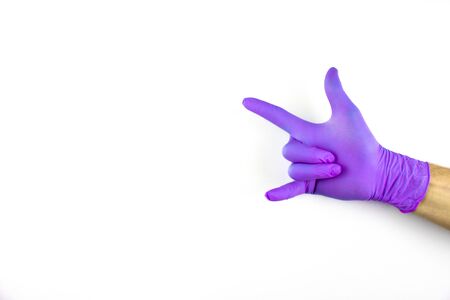Male hand in medical glove on white background.の写真素材
