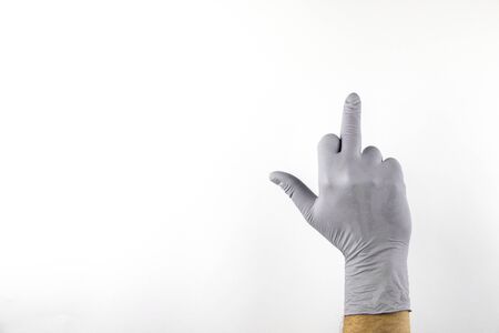 Male hand in medical glove on white background.の写真素材