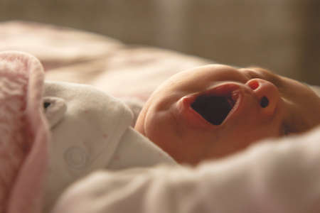 baby yawning close-up photo