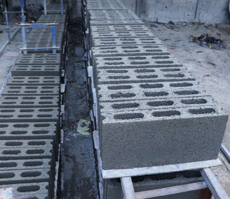 Stacking of concrete blocks laying on the ground