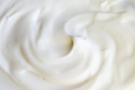 Sour cream curl, white texture background, flat layの写真素材