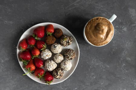 Â energy balls and dalgona coffee on a gray background, flat lay, trendy food 2020, wholesome breakfast, horizontal orientationの写真素材