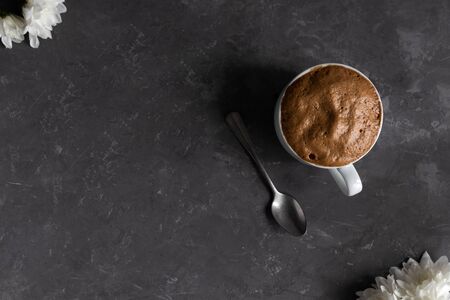 Trendy drink while blocking the city of Covid-19 and quarantine - Dalgona Coffee in a white cup, Whipped Trendy Korean Coffee.の写真素材