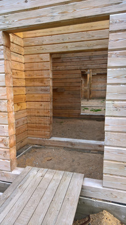 Interior of an unfinished wooden cabin under constructionの写真素材