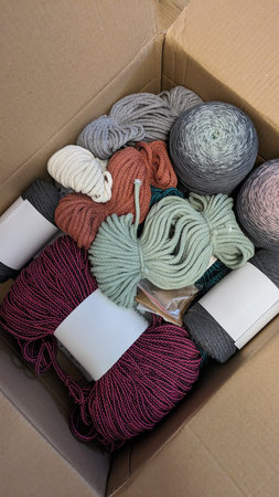 Assorted Yarn and Macrame Cord in a Cardboard Boxの写真素材