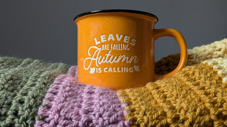 Cozy Autumn Mug on Knitted Blanketの写真素材