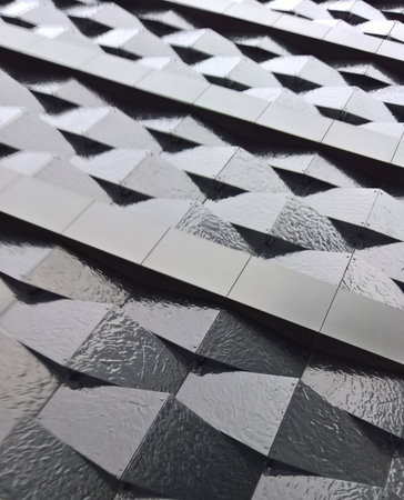 Modern black facade with geometric shapes. Stylish black building exterior featuring minimalist...