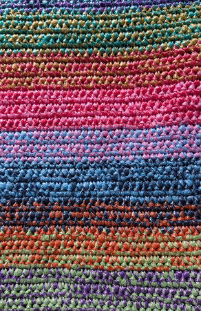 Vibrant Multicolored Crocheted Fabric with Striped Texture