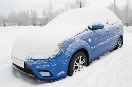 The car under snow on parking, after a snowfallの写真素材