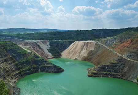 The flooded open-cast mine where extraction of nickel ore earlier was made. Russiaの写真素材