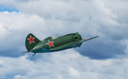 Soviet fighter aircraft I-16 is flying against cloudy skyのeditorial素材