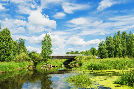 Beautiful landscape, unusually combining a road bridge across the river, and the beauty of natureの写真素材