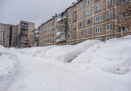 GUBAKHA, PERM KRAI, RUSSIA - MARCH 2, 2017: Huge snowdrifts in the courtyard after a snowfallのeditorial素材