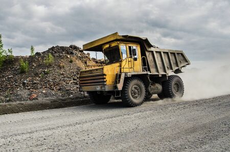 PERVOURALSK, RUSSIA - JUNE 06, 2017: BelAZ truck transports ore on a dirt roadのeditorial素材