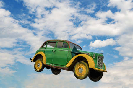 SVERDLOVSK REGION, RUSSIA - JUNE 15, 2017: Rare car in a jump against a blue sky with white clouds in summer day, Russia, Uralのeditorial素材