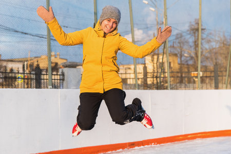Mom and daughter at the ice rink, mom teaches daughter to skate