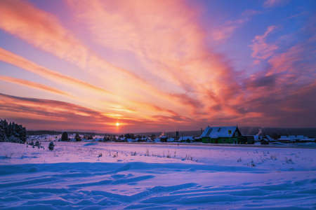 Beautiful winter dawn in a Russian villageの写真素材