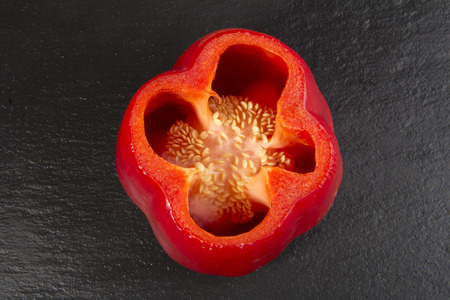 Red Pepper on a Black Slate Background