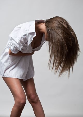 fashion nude photo of young woman in white shirtの写真素材