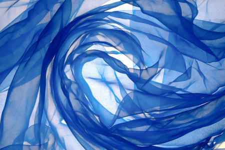 background from a fabric with folds, illumination behindの写真素材