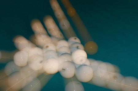 Billiard balls scattering in the different sides after impact.