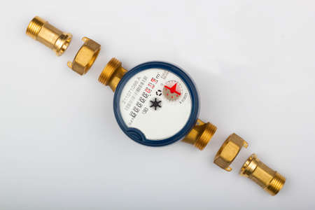 Disassembled water meter with details for measures the quantity and volume of water that passes...
