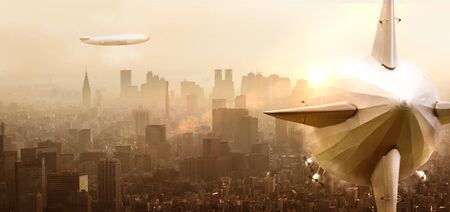 Airship over a city with sunsetの写真素材