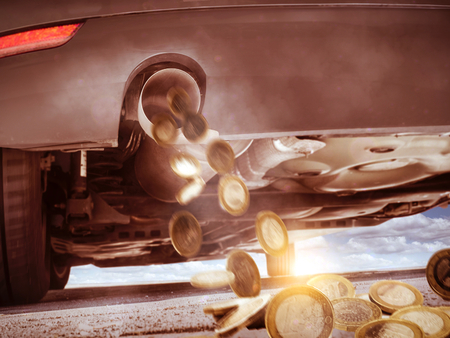 Car consumes moneyの写真素材