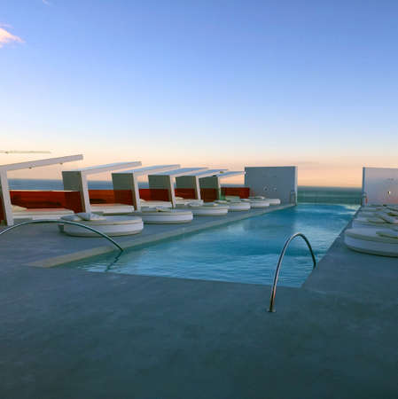 Modern Hotel Rooftop pool at dusk.のeditorial素材