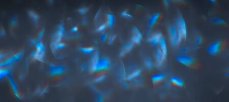 Soft colorful bokeh background. Luminous garlands of electric lights. Copy space to add text. Saturated colors. Blurry abstraction. Gentle tone. Dark night. Festive party in city. Defocus effect.の写真素材