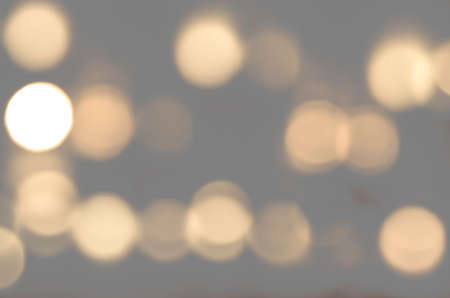 Soft colorful bokeh background. Luminous garlands of electric lights. Copy space to add text. Saturated colors. Blurry abstraction. Gentle tone. Dark night. Festive party in city. Defocus effect.の写真素材