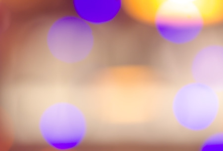 Soft colorful bokeh background. Luminous garlands of electric lights. Copy space to add text. Saturated colors. Blurry abstraction. Gentle tone. Dark night. Festive party in city. Defocus effect.の写真素材