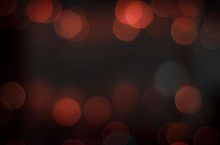 Soft colorful bokeh background. Luminous garlands of electric lights. Copy space to add text. Saturated colors. Blurry abstraction. Gentle tone. Dark night. Festive party in city. Defocus effect.の写真素材