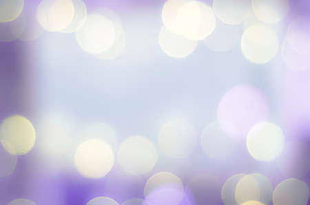 Soft colorful bokeh background. Luminous garlands of electric lights. Copy space to add text. Saturated colors. Blurry abstraction. Gentle tone. Dark night. Festive party in city. Defocus effect.の写真素材