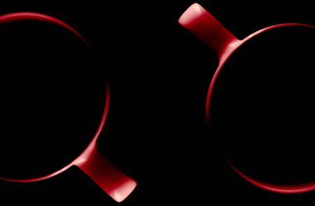 A pair of cups. Illuminated upper circuit. View from above. Isolated on black. Copy space to add your text.の写真素材