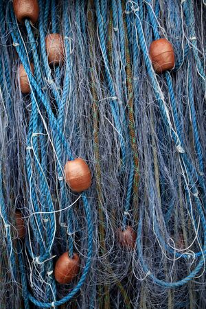 Close-up of fishing nets with floats の写真素材
