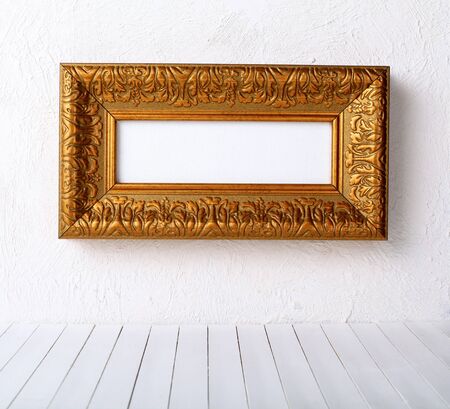 old  frames over the white wall background の写真素材