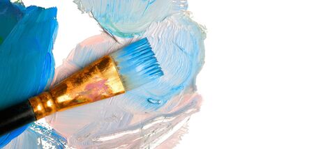 Paintbrush with blue paint, isolated on white background の写真素材