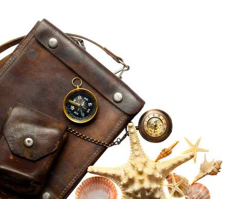 Vintage leather bag with a compass and a pocket clock isolation on a white backgroundの写真素材