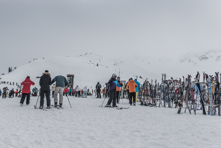 Large amount of assorted snowboard and ski equipment stored at top of Whistler Mountain, Canadaの写真素材