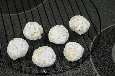 Buttery almond cookies on wire cooling rackの写真素材