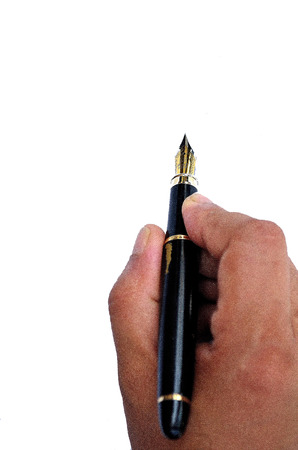 Human hand writing thank you with fountain pen on isolated white backgroundの写真素材