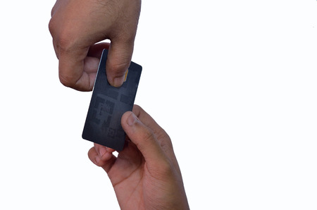 Two hands exchanging credit card on white background
