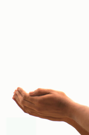 Praying with two hands folded on white backgroundの写真素材